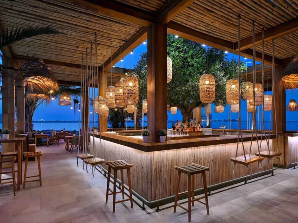 Ula beachfront happy hours in Ras Al Khaimah with sea views and cocktails